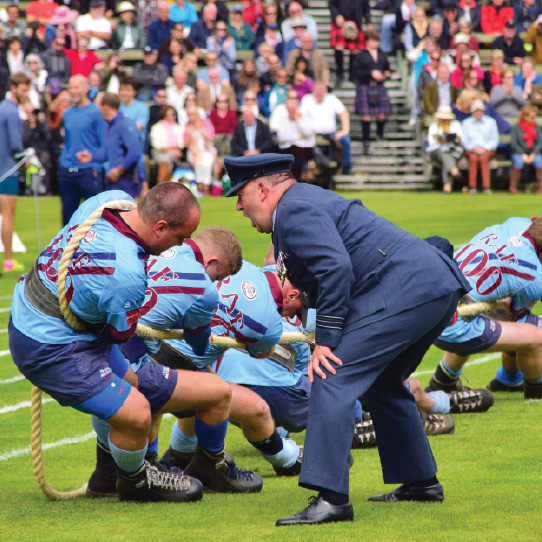Tug-of-war team pulling a rope during an outdoor competition