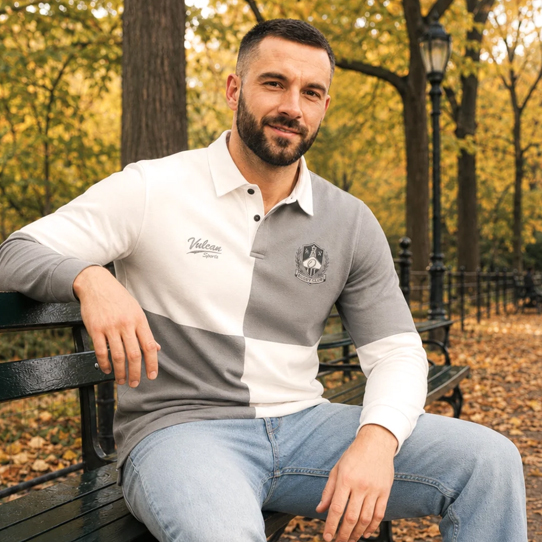 Man wearing a white traditional rugby shirt outdoors